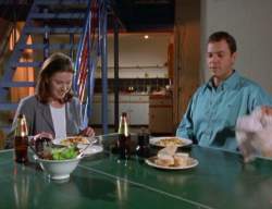Slade cooks for Holly - they are eating on the table tennis table.